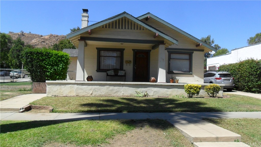 3995 Pine Street Riverside, CA 92501 - Photo 1 of 1 a front view of a house with a yard