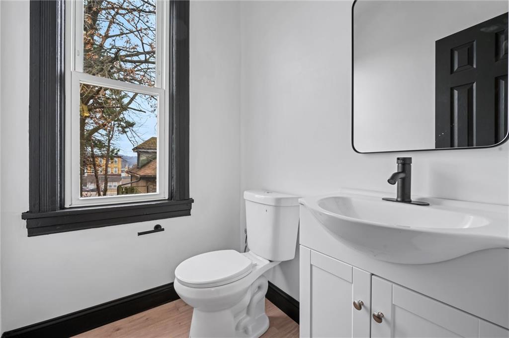 8 Marie Avenue Avalon, PA 15202 - Photo 15 of 48 a bathroom with a sink toilet and mirror