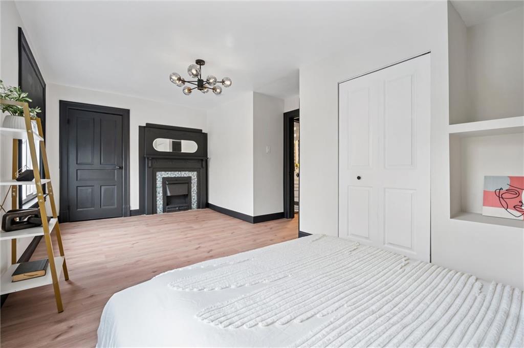 8 Marie Avenue Avalon, PA 15202 - Photo 22 of 48 a bedroom with a bed and a chandelier