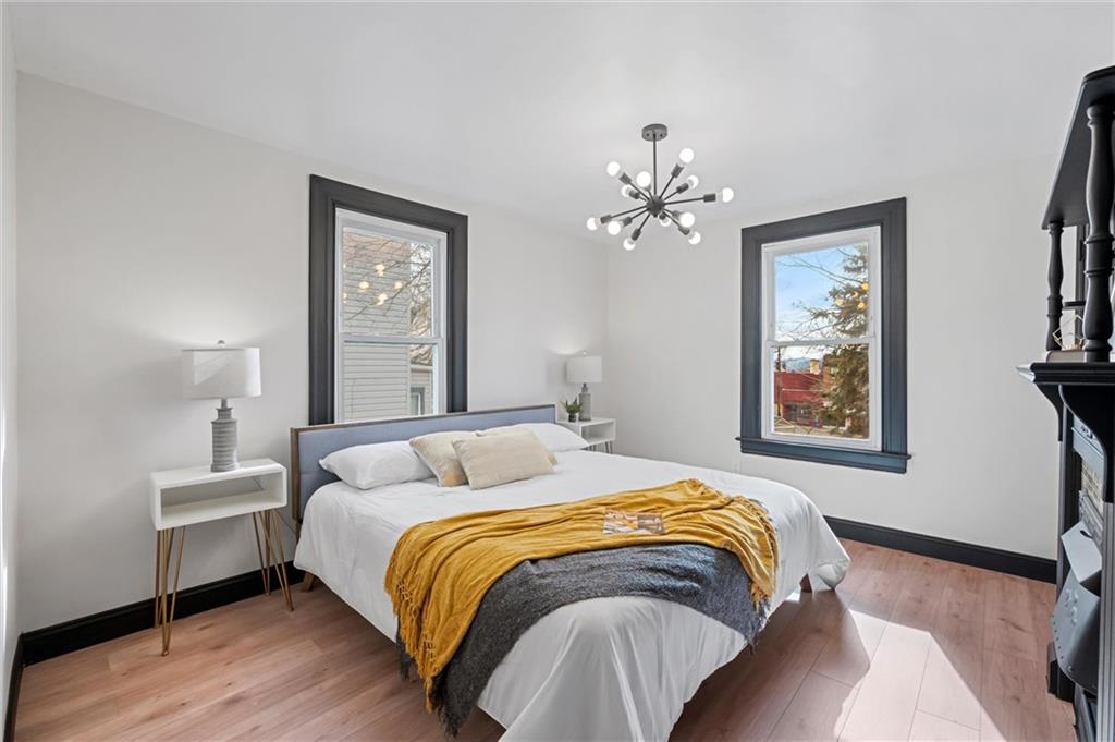 8 Marie Avenue Avalon, PA 15202 - Photo 23 of 48 a bedroom with a bed and a painting on the wall
