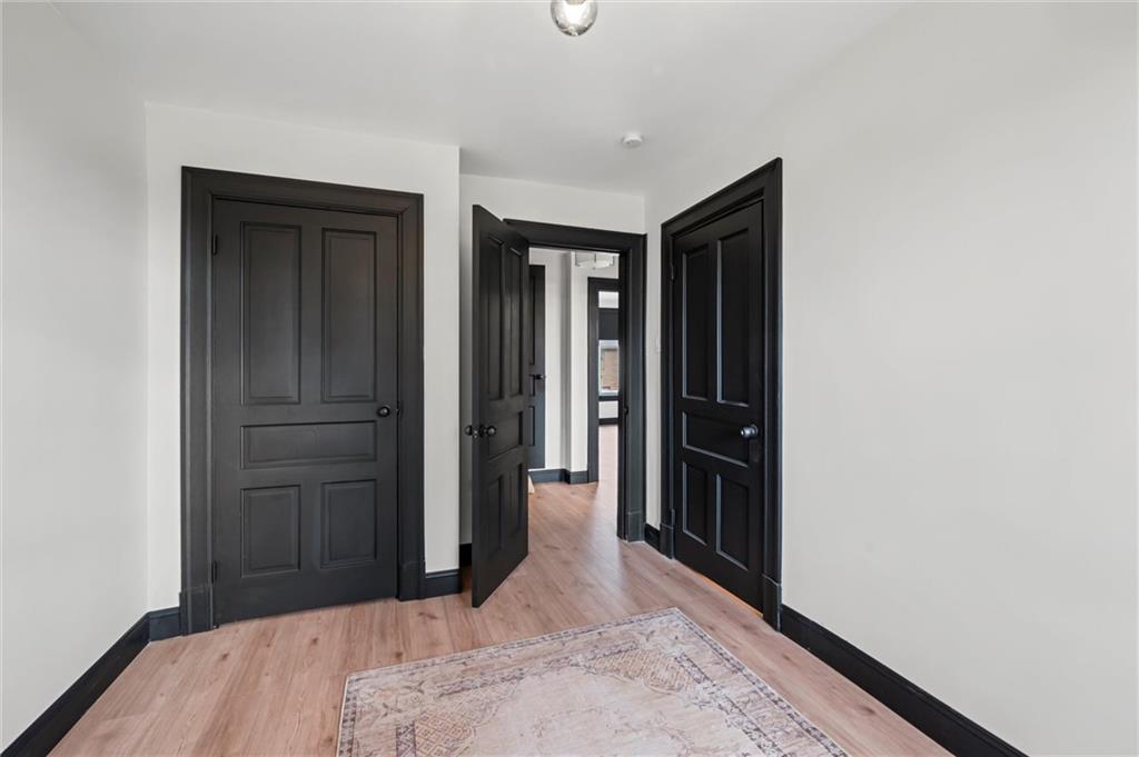 8 Marie Avenue Avalon, PA 15202 - Photo 26 of 48 a bedroom with a bed and wooden floor
