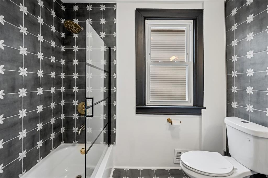 8 Marie Avenue Avalon, PA 15202 - Photo 27 of 48 a bathroom with a toilet and a shower