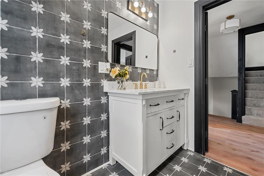 8 Marie Avenue Avalon, PA 15202 - Photo 29 of 48 a bathroom with a sink a vanity and a mirror