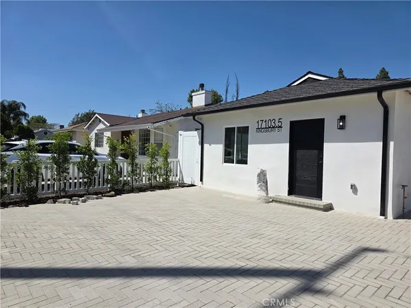 a front view of a house with a outdoor space