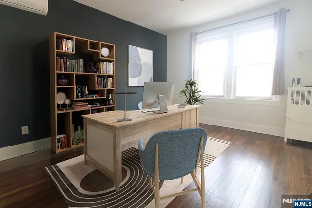 a kitchen with a stove a kitchen island a dining table and chairs