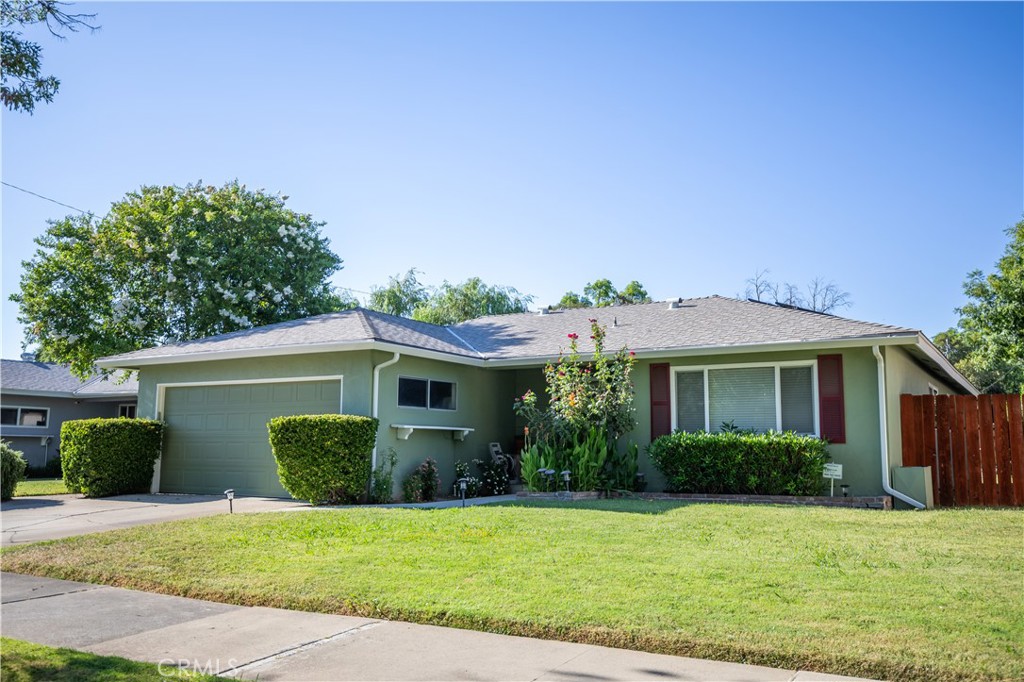 847 Seneca Street Merced, CA 95340 - Photo 5 of 6 a front view of a house with a yard and potted plants