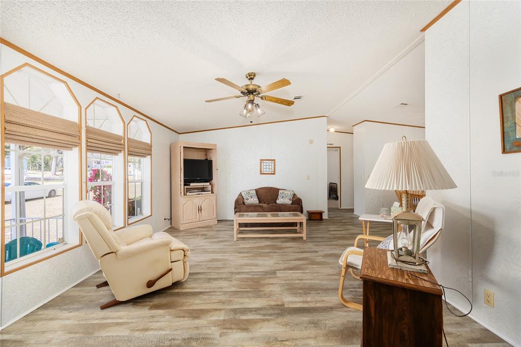 2335 North Loma Point Hernando, FL 34442 - Photo 12 of 47 a living room with furniture and a large window