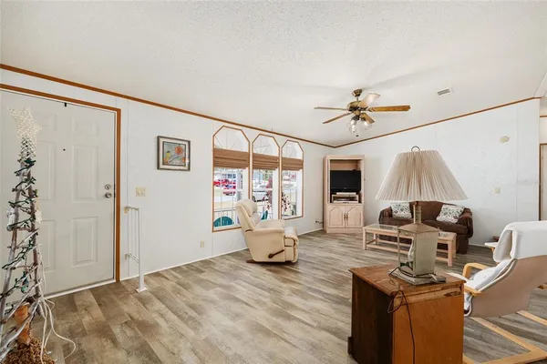 a view of a livingroom with furniture and a flat screen tv