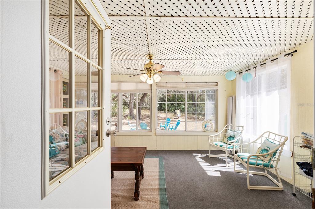 2335 North Loma Point Hernando, FL 34442 - Photo 39 of 47 a living room with furniture and a large window