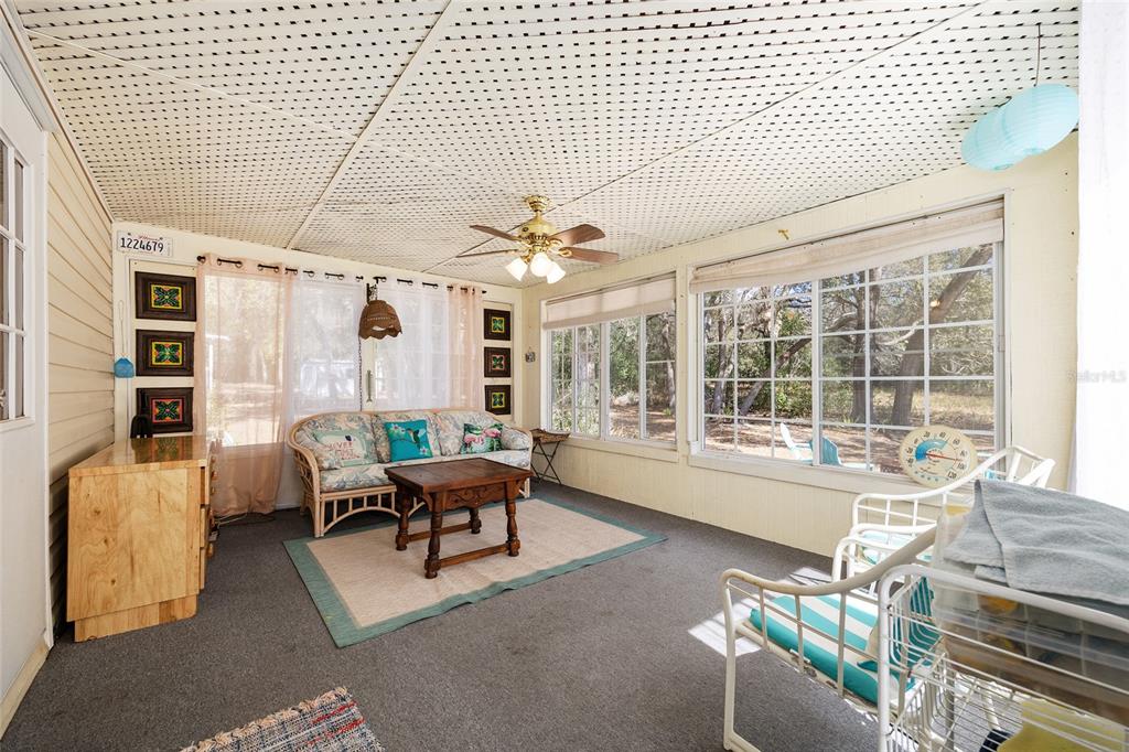 2335 North Loma Point Hernando, FL 34442 - Photo 42 of 47 a living room with furniture and large windows