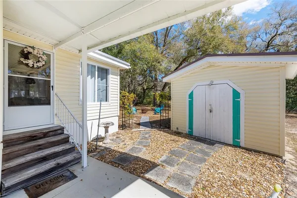 a view of a porch with a bench