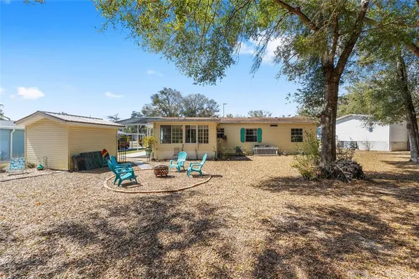 a house view with a sitting space and garden