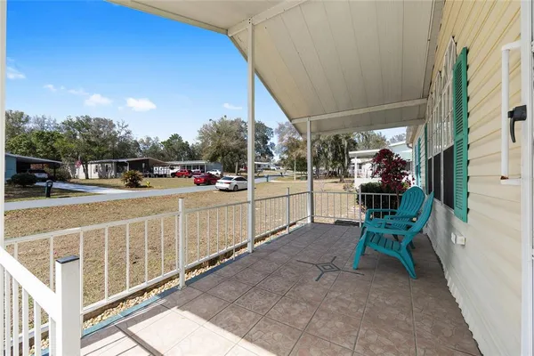 a view of a porch with furniture