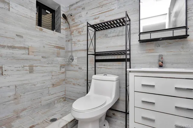 a bathroom with a toilet and a sink