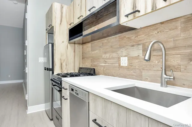 a bathroom with a sink a toilet and bathtub