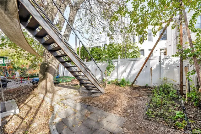 a view of street with parked cars