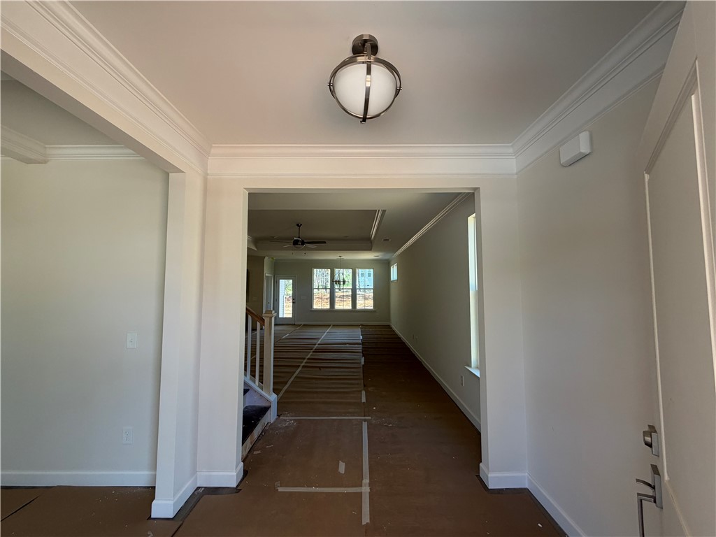 110 Lakeside Drive Anderson, SC 29621 - Photo 2 of 8 This welcoming entryway features crown molding and a clear sightline into the expansive living area.