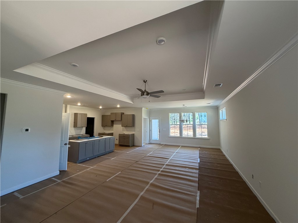 110 Lakeside Drive Anderson, SC 29621 - Photo 4 of 8 This versatile open-concept space features stylish tray ceilings, ideal for modern living.