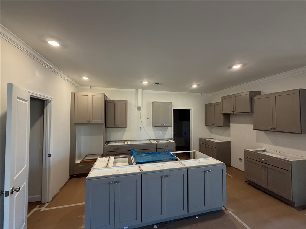 110 Lakeside Drive Anderson, SC 29621 - Photo 5 of 8 This spacious kitchen offers ample cabinetry and an island, perfect for culinary endeavors.