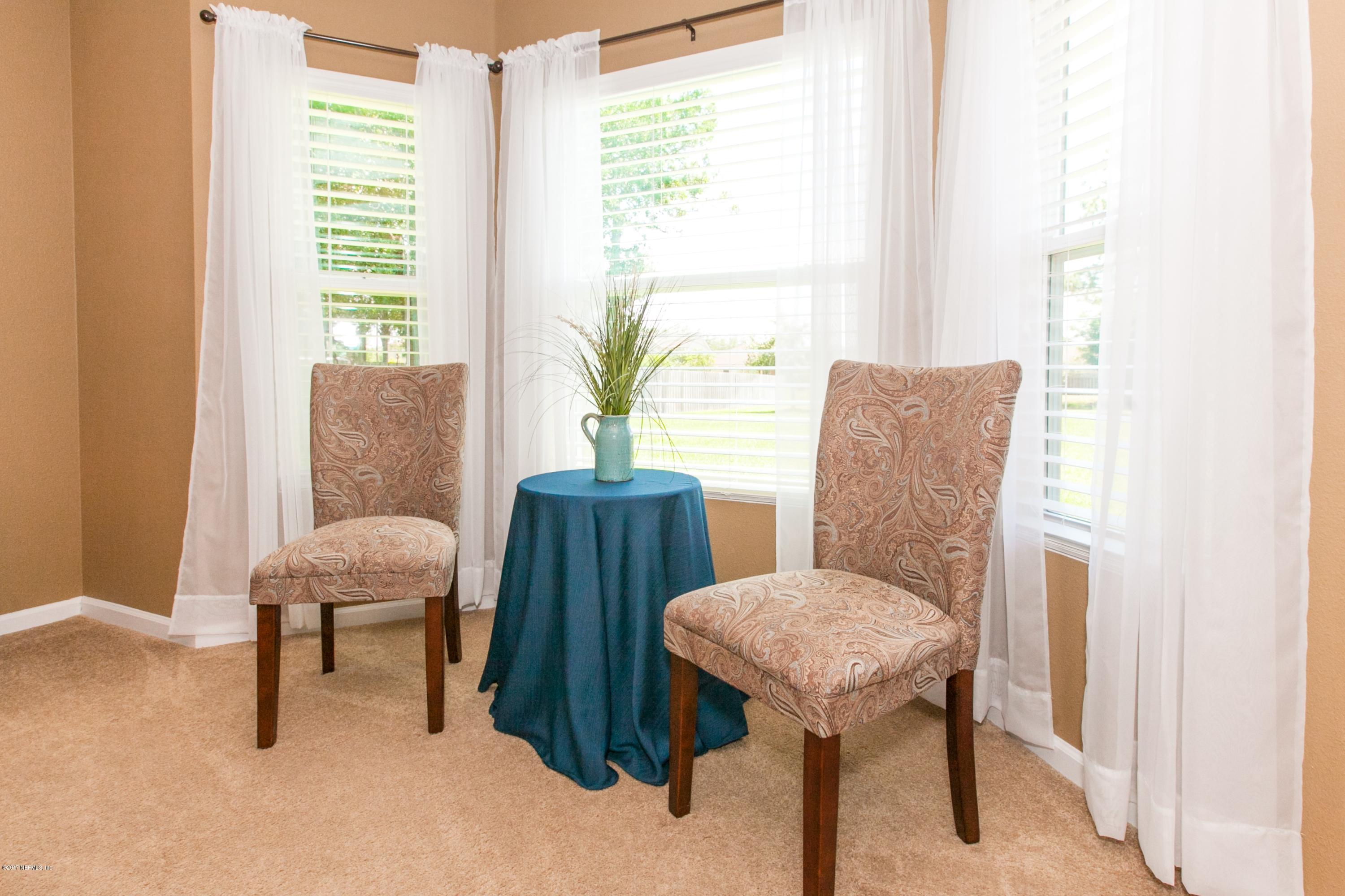 490 Irish Rose Road St. Augustine, FL 32092 - Photo 18 of 44 a view of a livingroom with furniture and a window