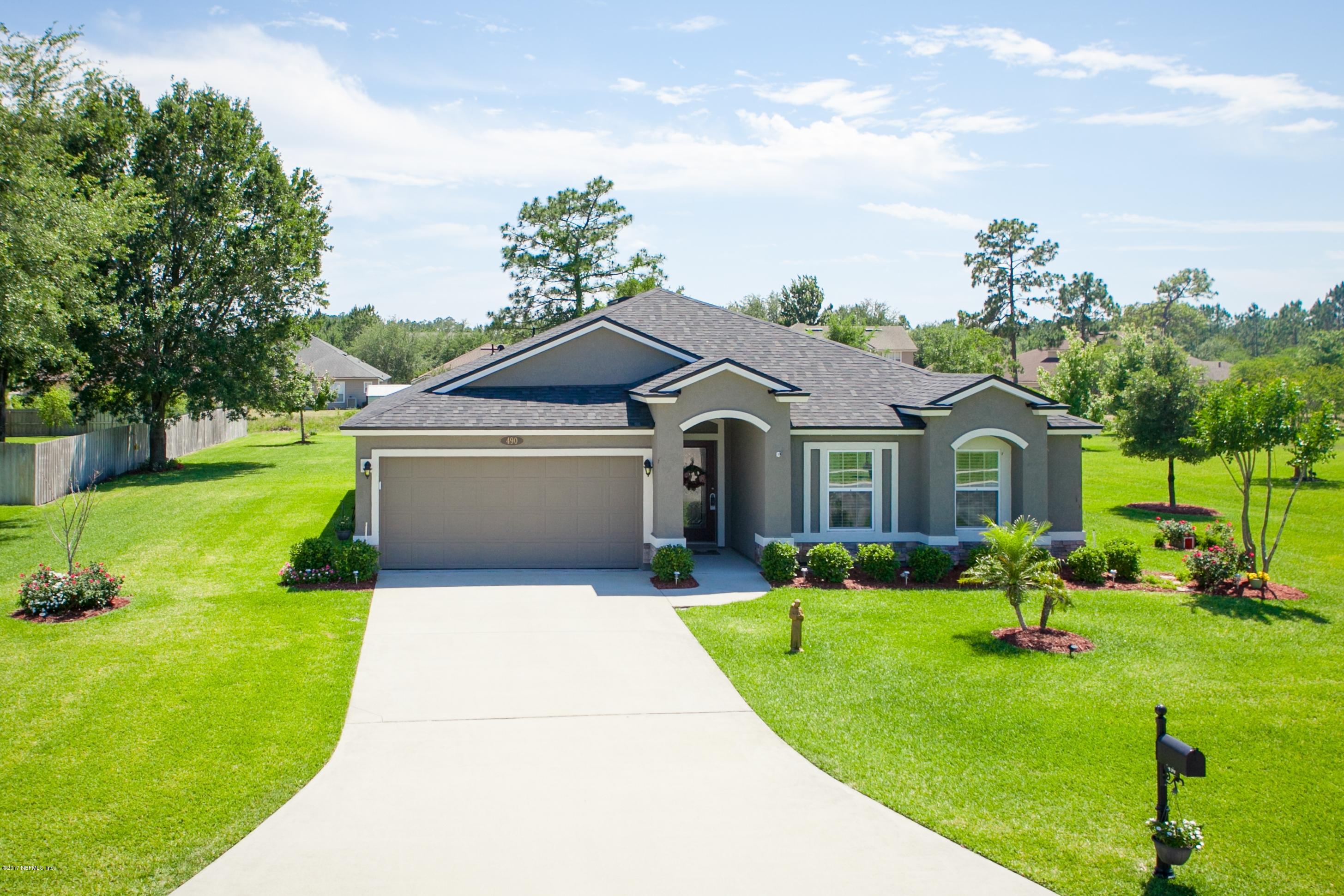 490 Irish Rose Road St. Augustine, FL 32092 - Photo 2 of 44 a front view of house with yard and green space