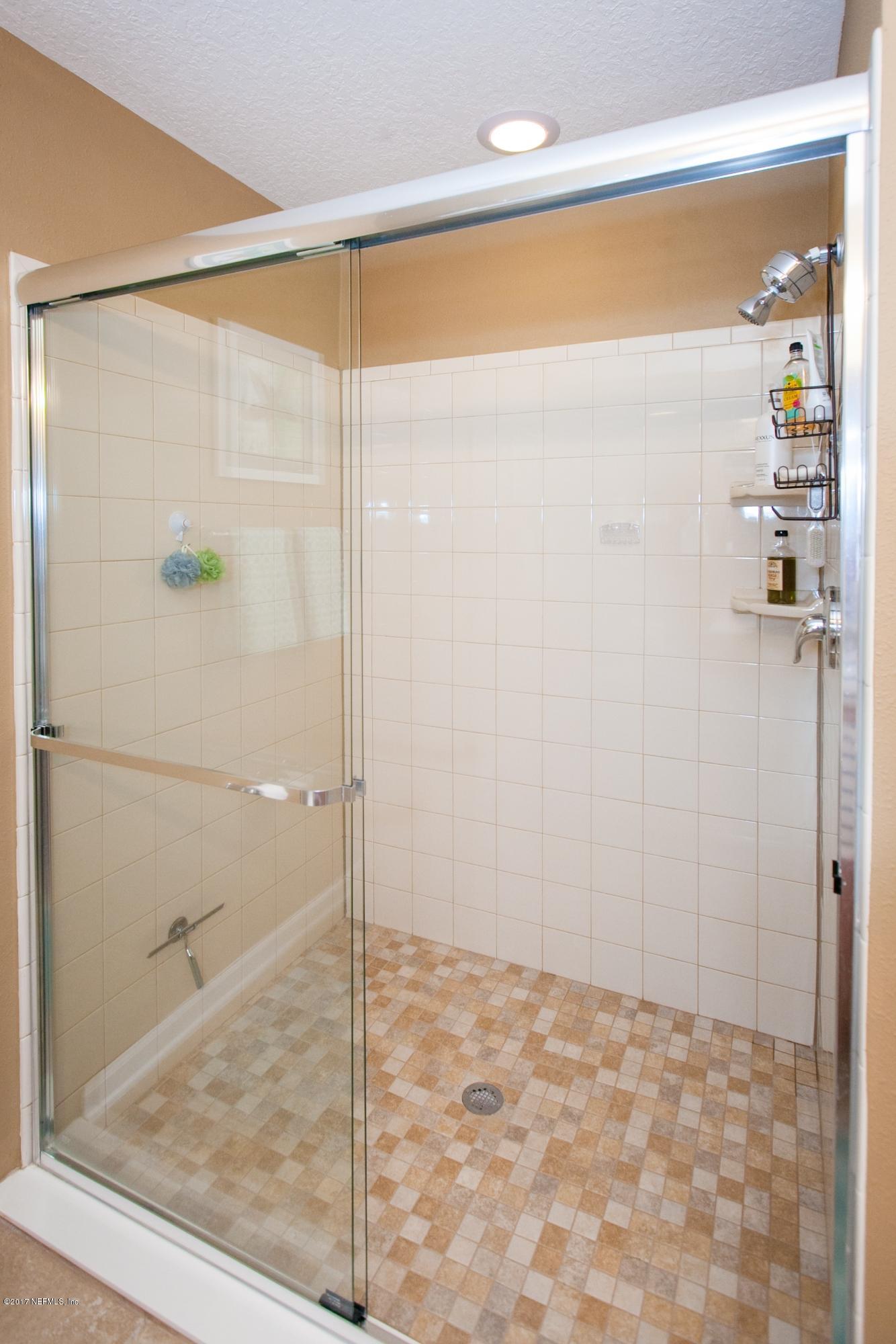 490 Irish Rose Road St. Augustine, FL 32092 - Photo 21 of 44 a bathroom with a shower
