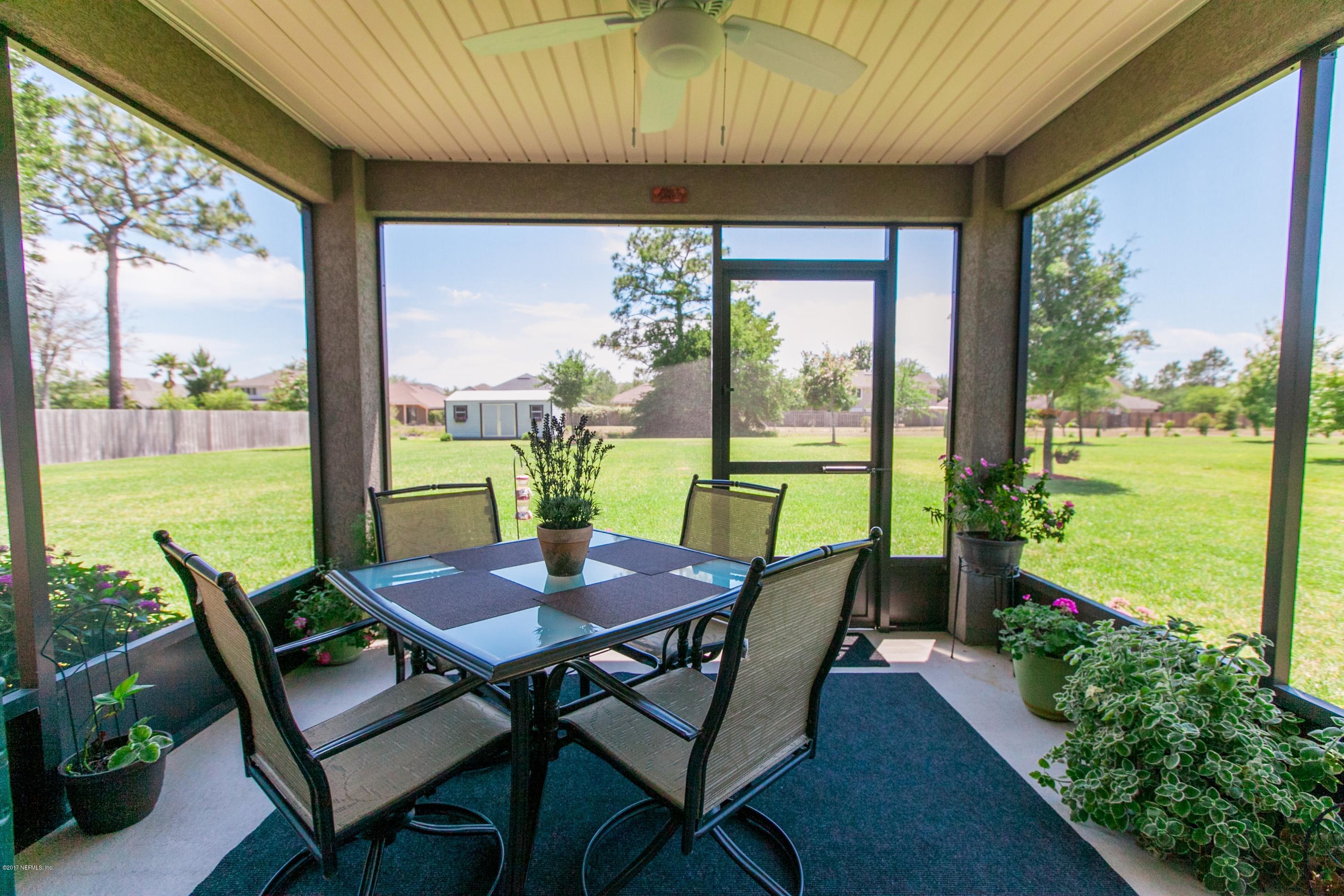 490 Irish Rose Road St. Augustine, FL 32092 - Photo 26 of 44 a view of a dining room with furniture window and outside view
