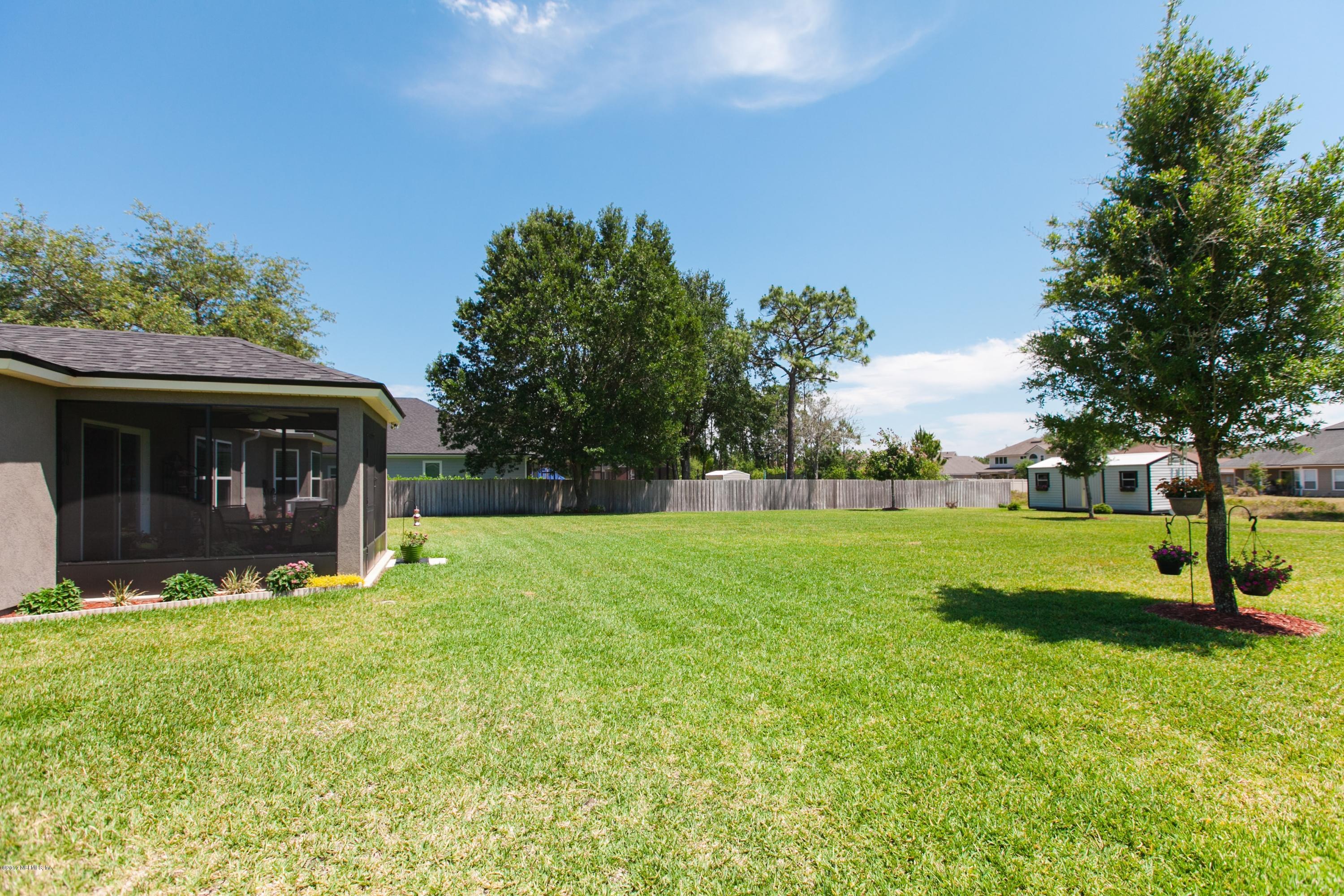 490 Irish Rose Road St. Augustine, FL 32092 - Photo 28 of 44 a view of a house with backyard and garden