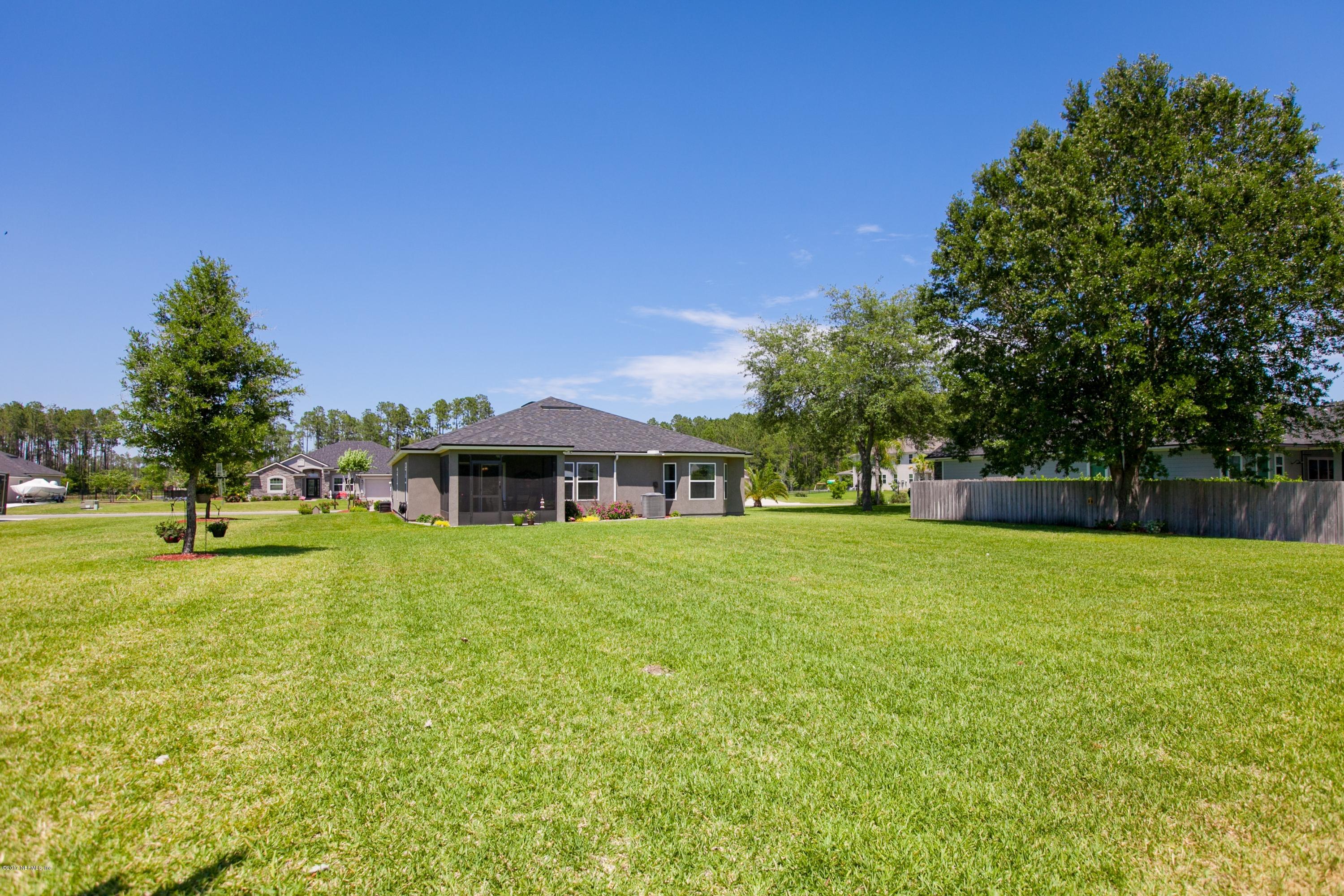 490 Irish Rose Road St. Augustine, FL 32092 - Photo 29 of 44 a view of a house with a big yard