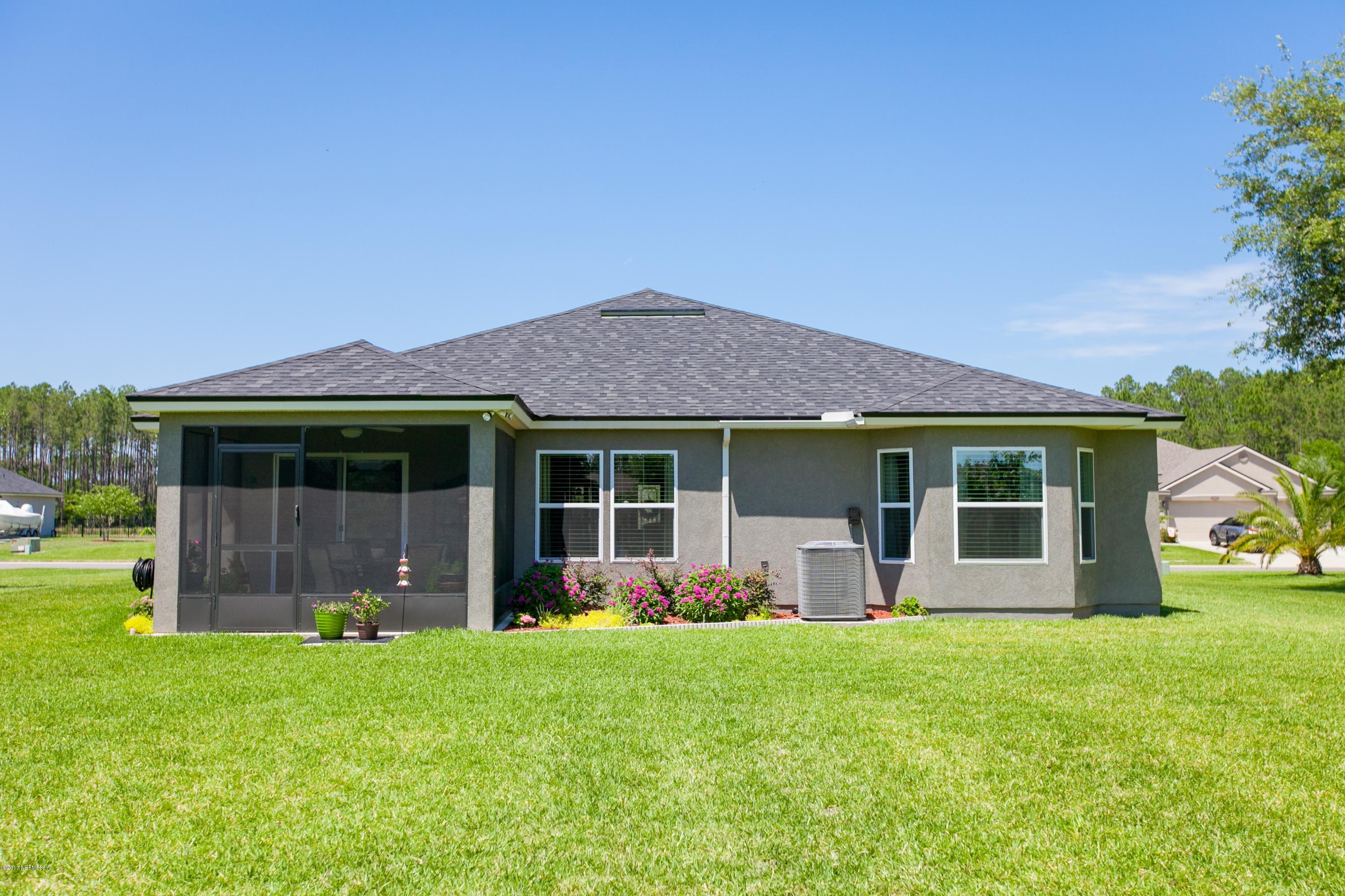 490 Irish Rose Road St. Augustine, FL 32092 - Photo 30 of 44 a front view of a house with garden
