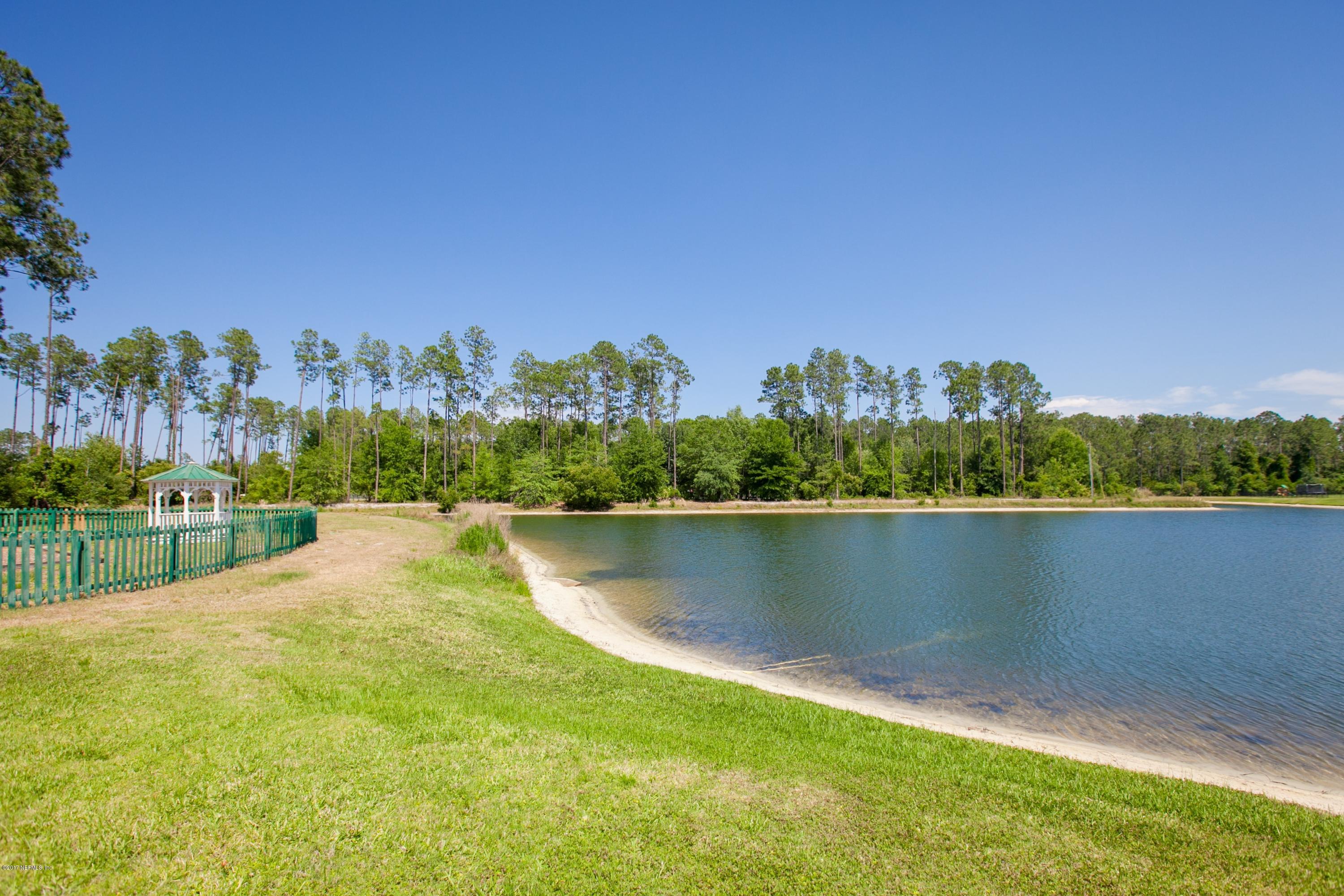 490 Irish Rose Road St. Augustine, FL 32092 - Photo 41 of 44 wooden view of a lake with houses in the back