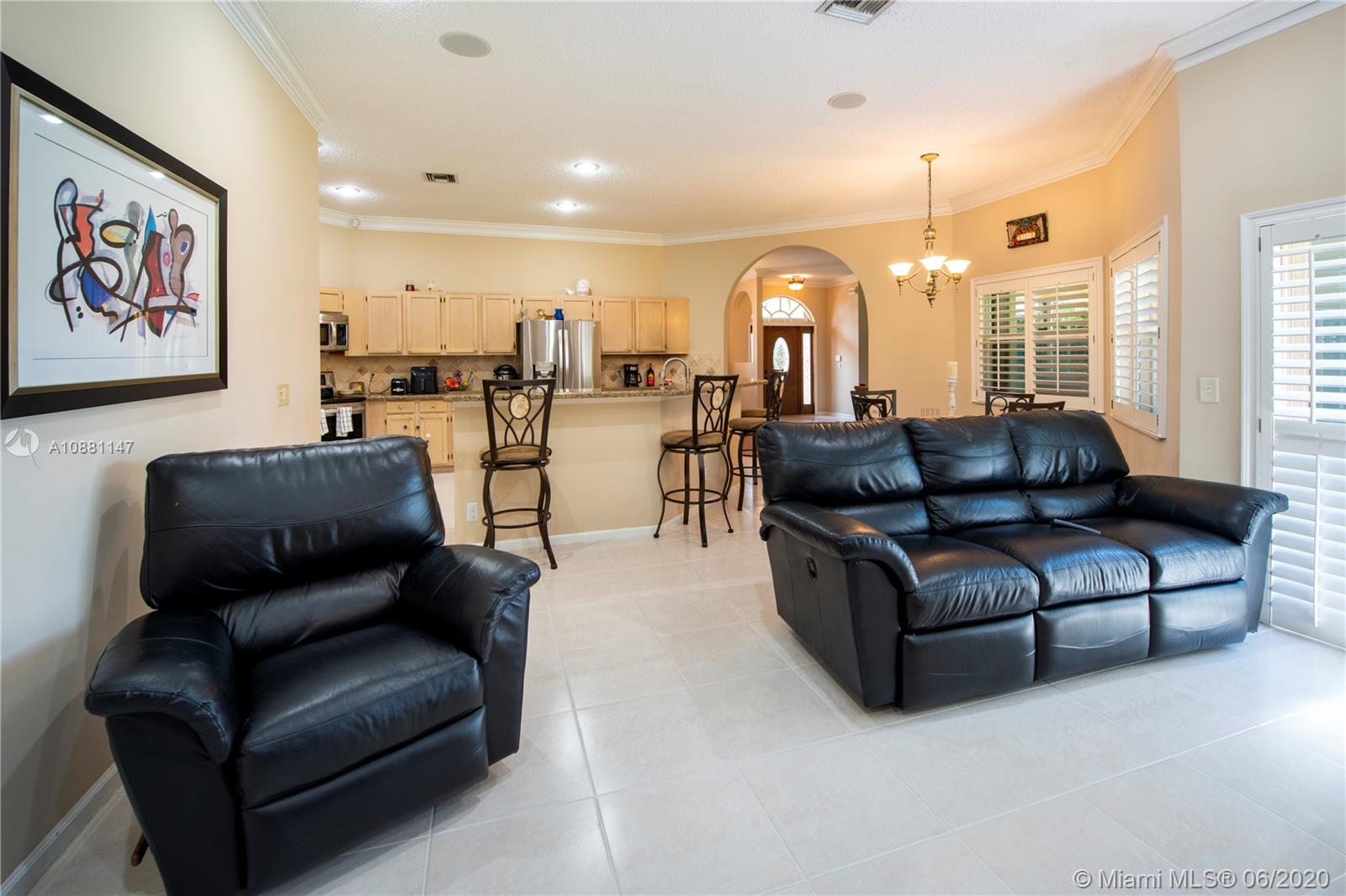 12346 Baywind Court Boca Raton, FL 33428 - Photo 15 of 31 a living room with furniture and a large window
