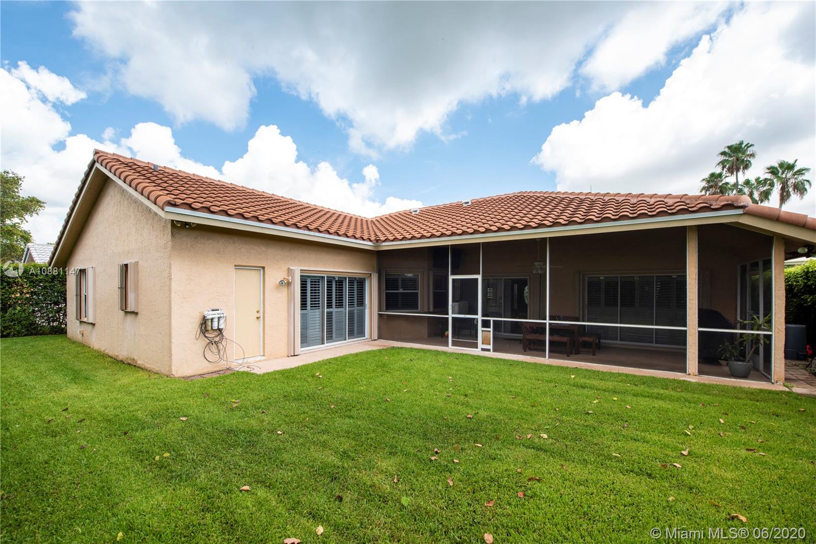 12346 Baywind Court Boca Raton, FL 33428 - Photo 29 of 31 a view of a house with a yard and a large tree