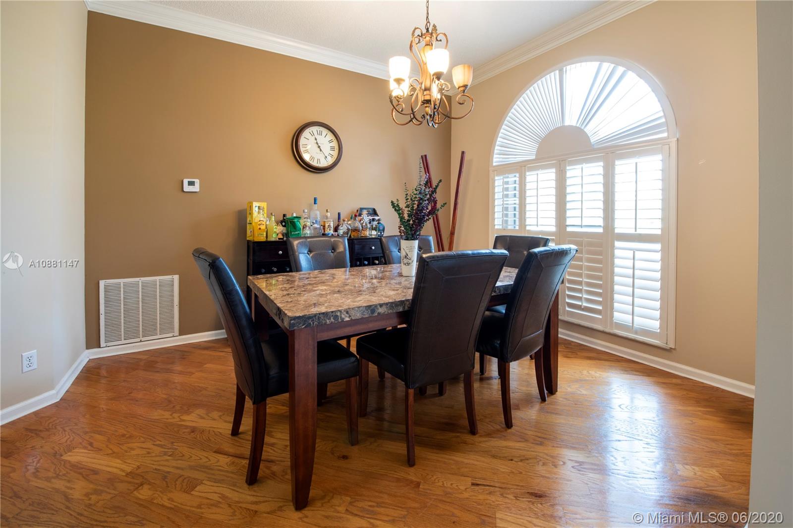 12346 Baywind Court Boca Raton, FL 33428 - Photo 5 of 31 a view of a dining room with furniture window and wooden floor