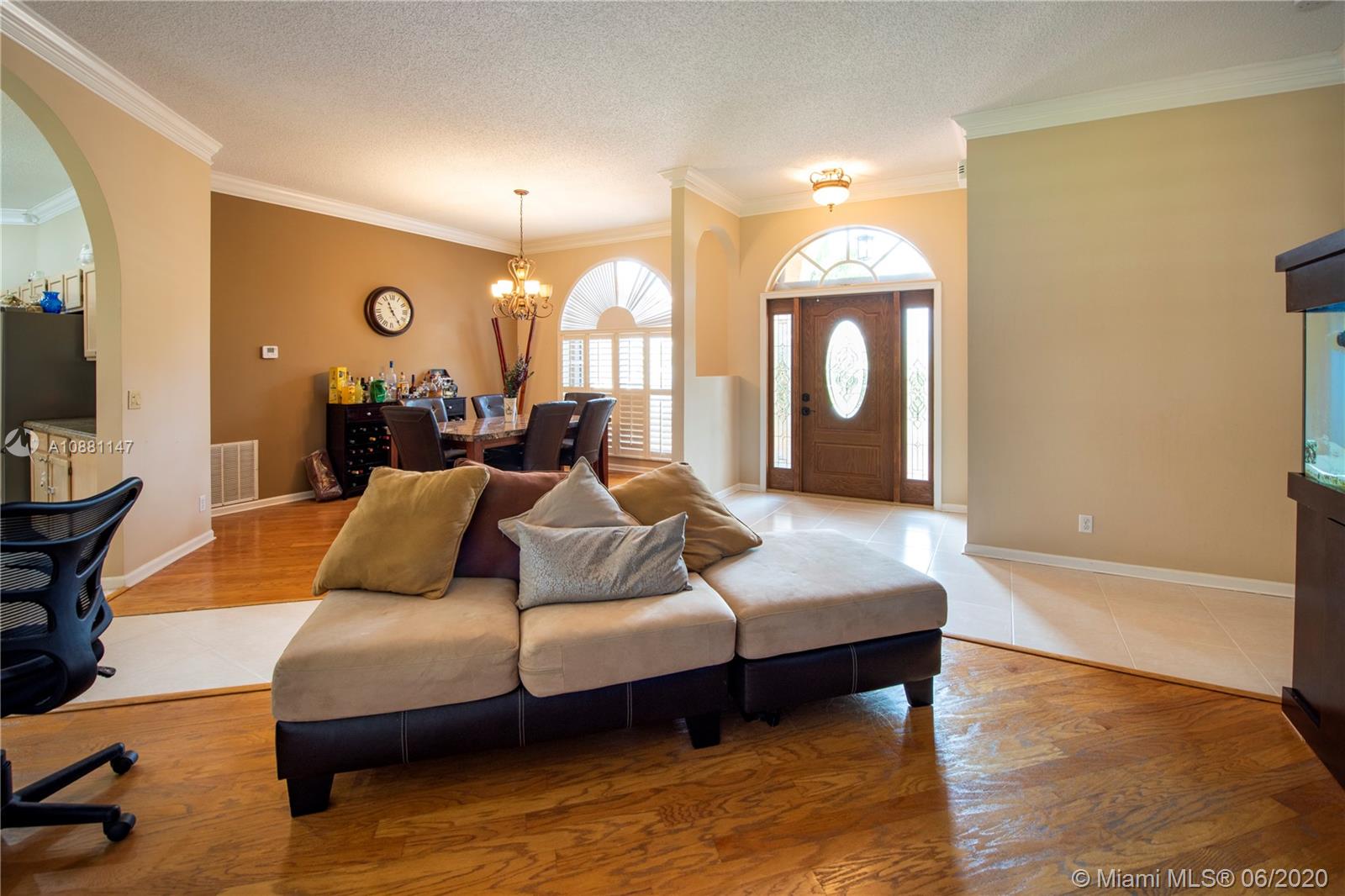 12346 Baywind Court Boca Raton, FL 33428 - Photo 6 of 31 a bedroom with a bed mirror and window