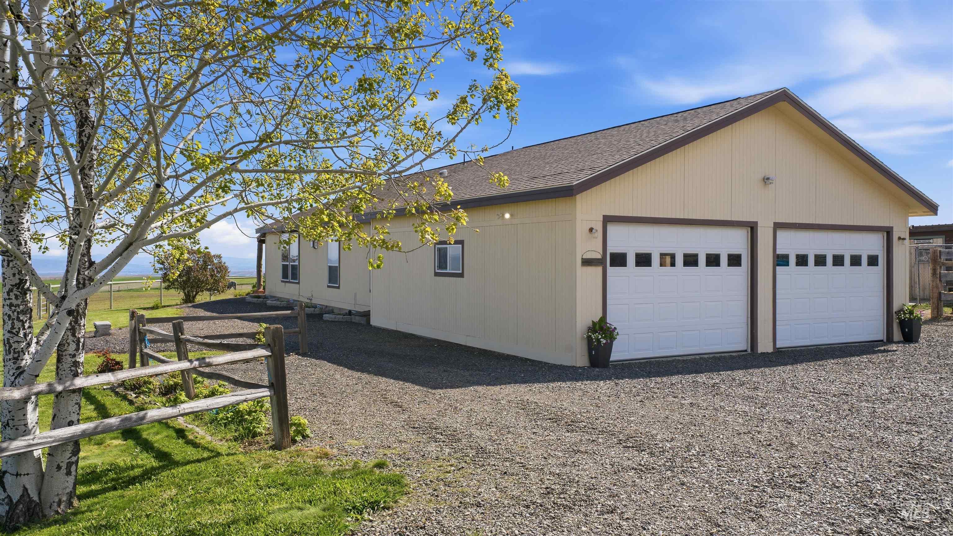 19397 Cloverland Road Asotin, WA 99402 - Photo 30 of 37 Two-car garage with panel doors and upper window inserts