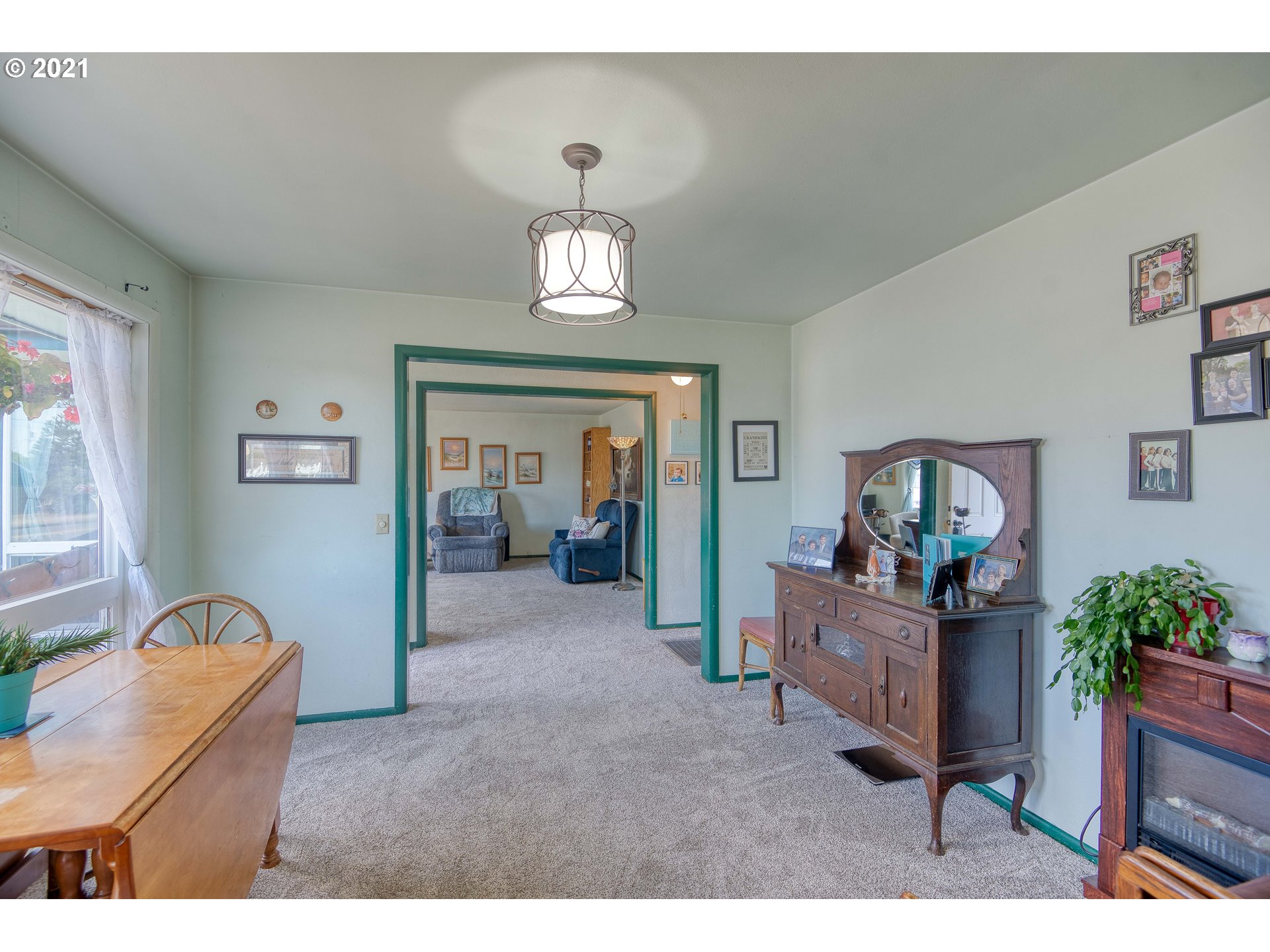 282 South Morrison Street Coos Bay, OR 97420 - Photo 11 of 29 a living room with furniture and a chandelier