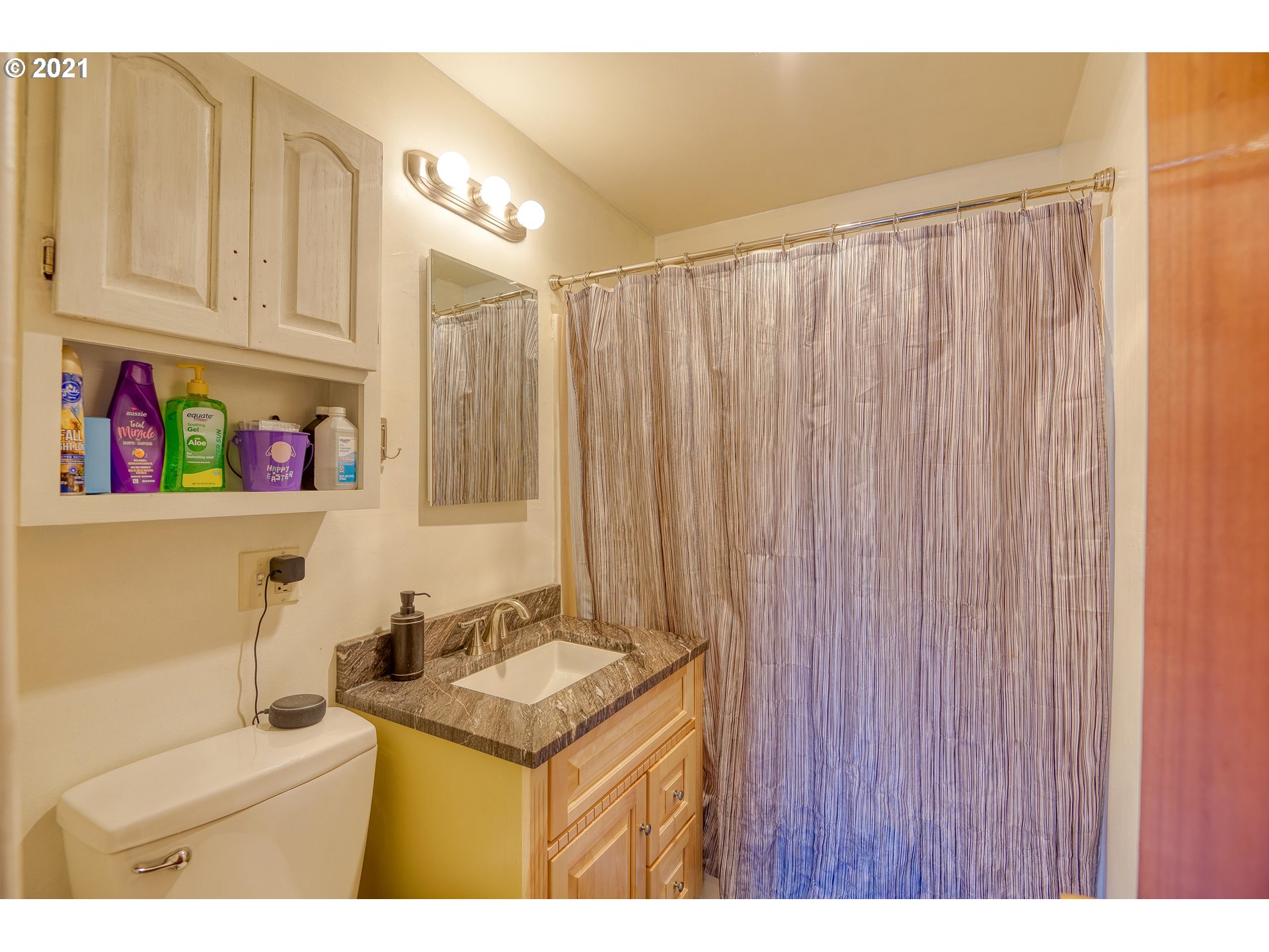 282 South Morrison Street Coos Bay, OR 97420 - Photo 15 of 29 a bathroom with a sink a vanity and a shower curtain