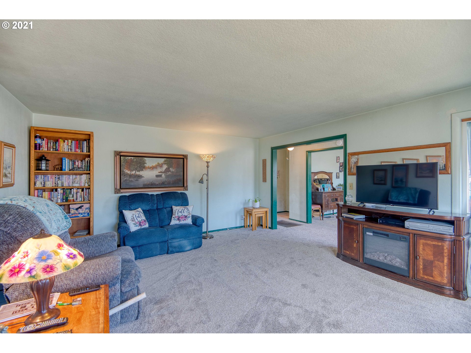 282 South Morrison Street Coos Bay, OR 97420 - Photo 6 of 29 a living room with furniture and a flat screen tv