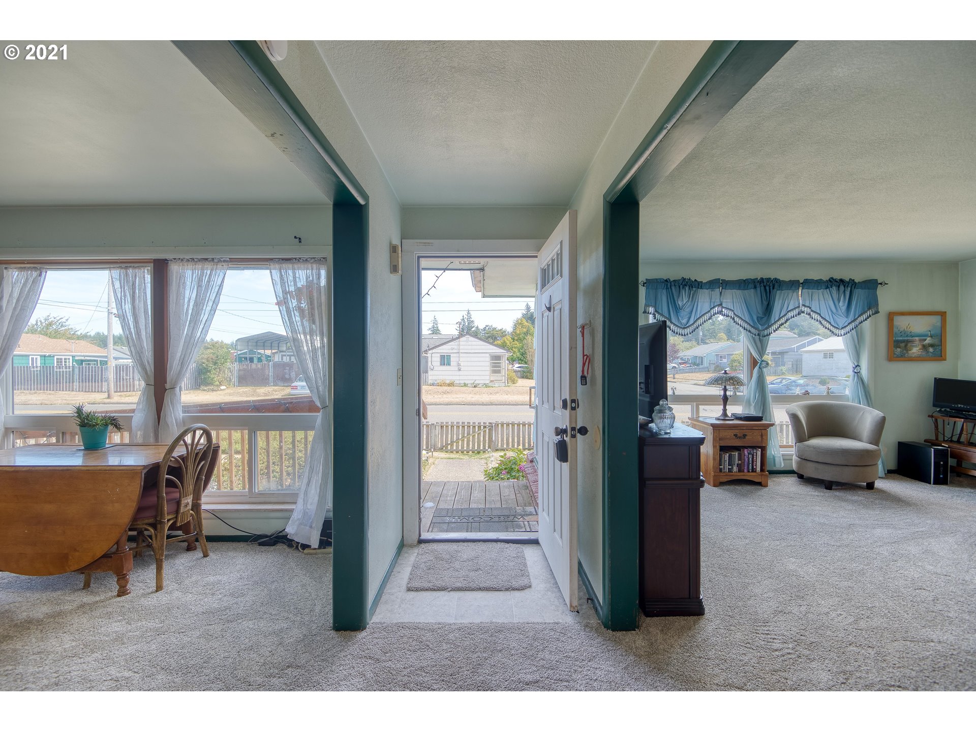 282 South Morrison Street Coos Bay, OR 97420 - Photo 8 of 29 a living room with furniture and a floor to ceiling window