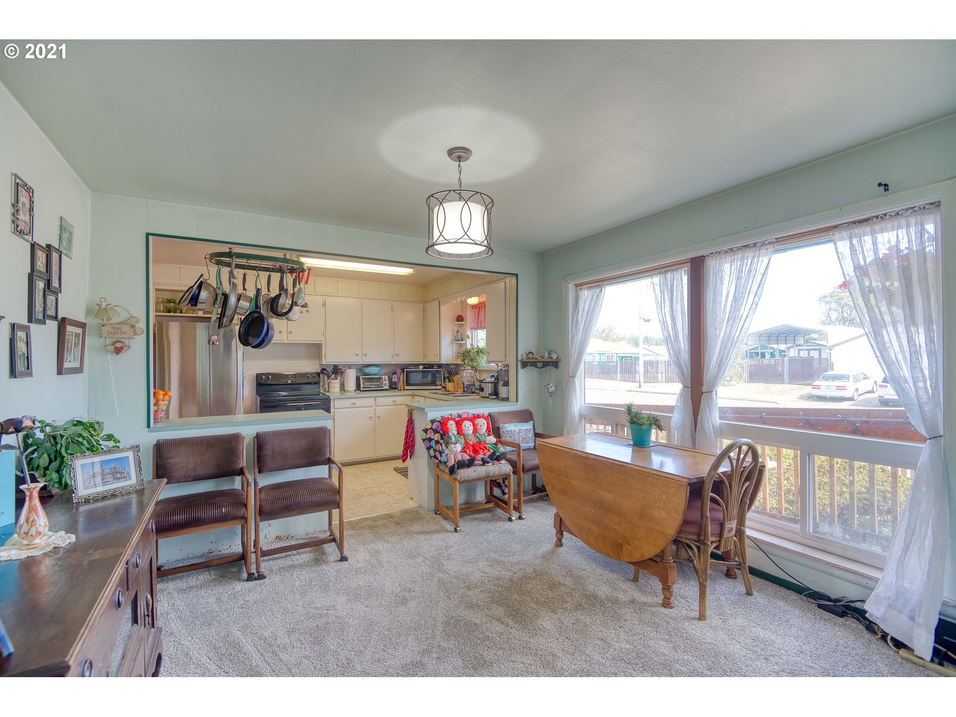 282 South Morrison Street Coos Bay, OR 97420 - Photo 10 of 29 a living room filled with furniture and a floor to ceiling window