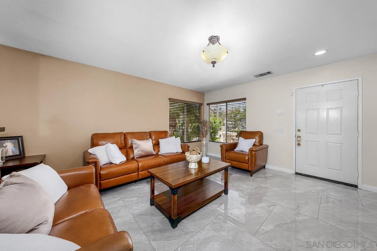 1631 Applegate Street Chula Vista, CA 91913 - Photo 12 of 34 a living room with furniture and a large window