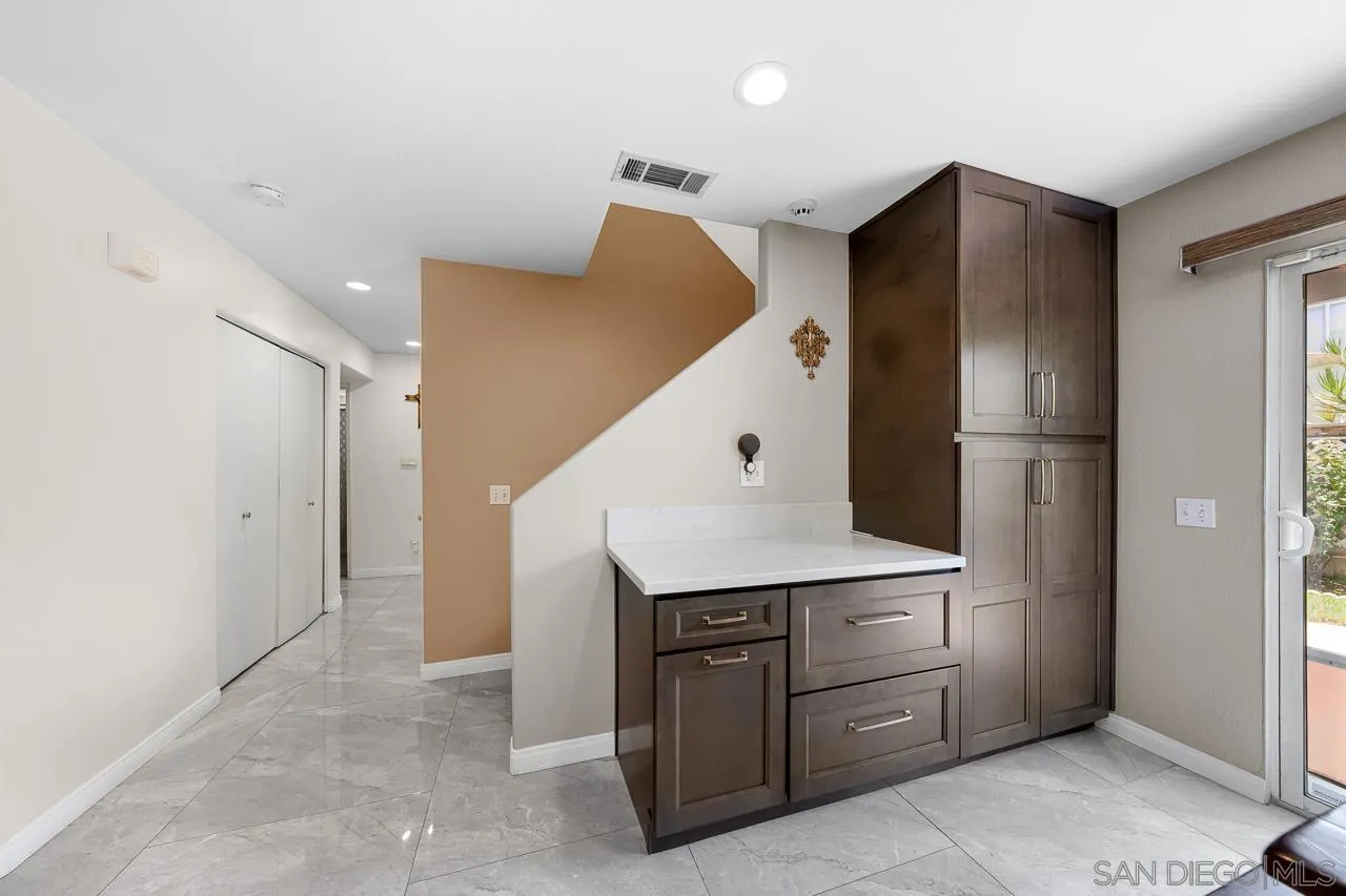 1631 Applegate Street Chula Vista, CA 91913 - Photo 19 of 34 a kitchen with a refrigerator and a sink