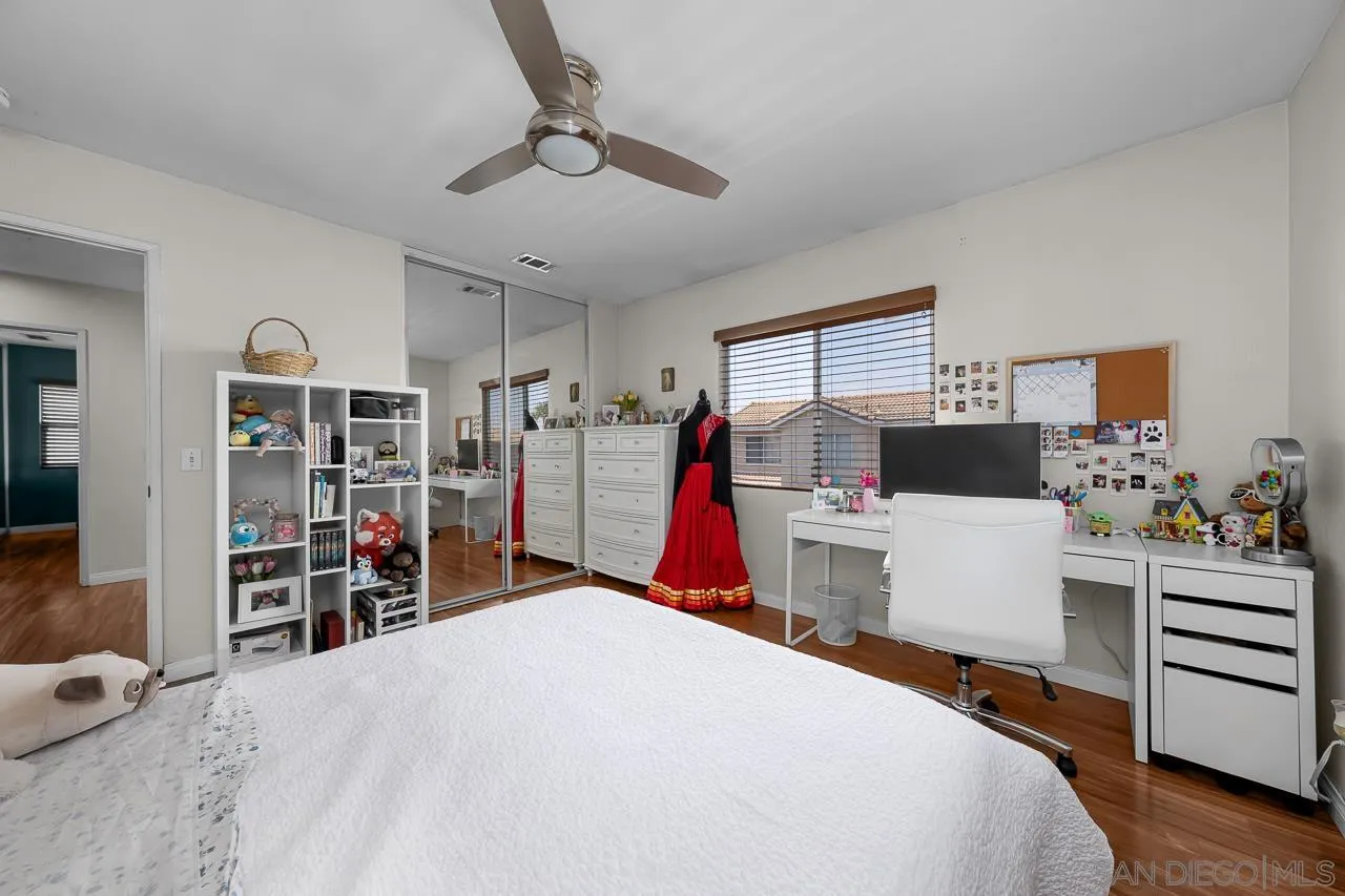 1631 Applegate Street Chula Vista, CA 91913 - Photo 23 of 34 a bed room with a bed and a desk