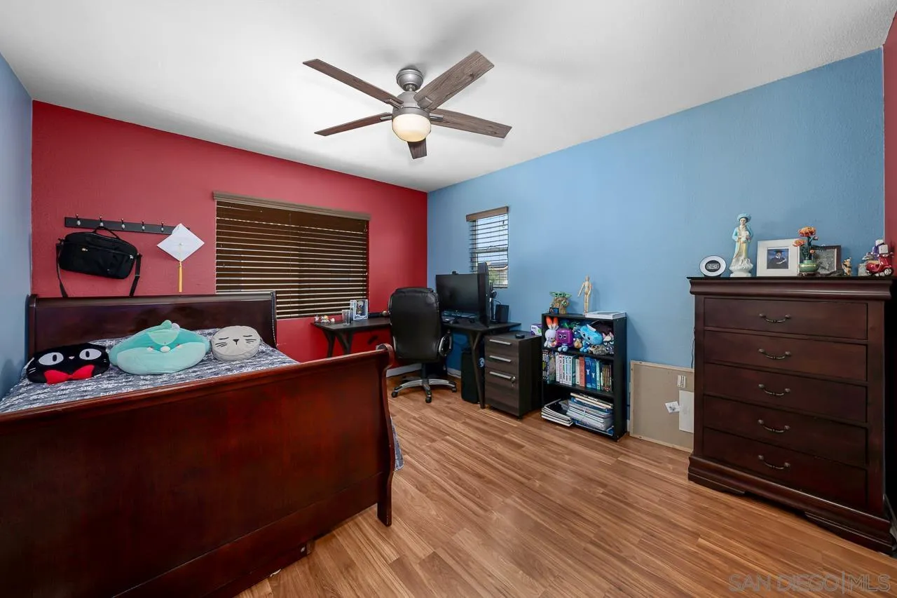 1631 Applegate Street Chula Vista, CA 91913 - Photo 24 of 34 a living room with furniture and a flat screen tv