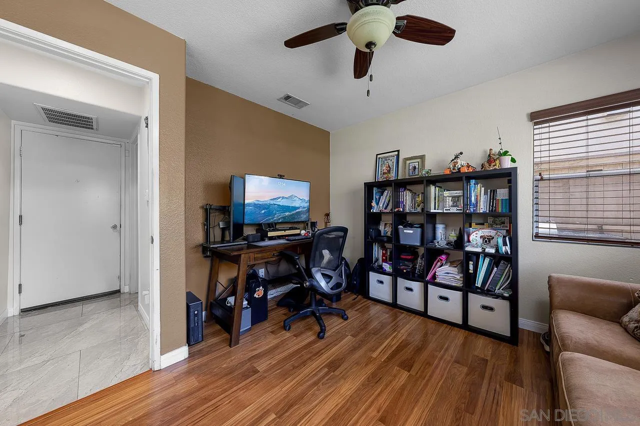 1631 Applegate Street Chula Vista, CA 91913 - Photo 29 of 34 a view of a livingroom with furniture and a bookshelf