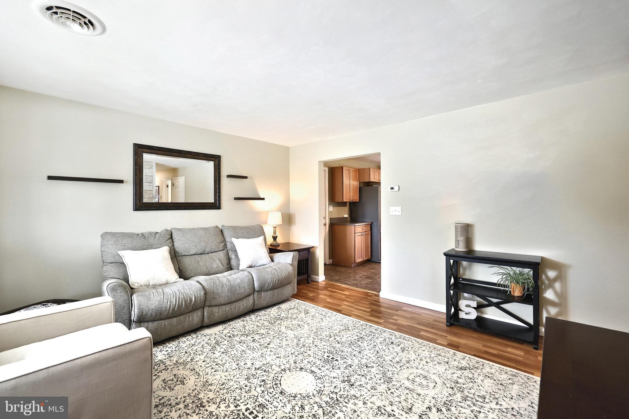 2569 Emig Mill Road Dover, PA 17315 - Photo 11 of 32 a living room with furniture and a rug