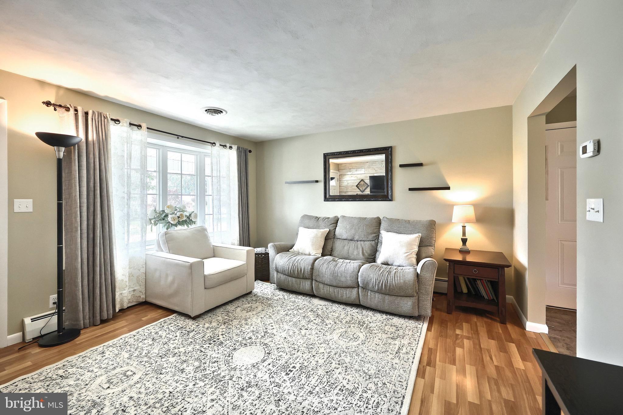 2569 Emig Mill Road Dover, PA 17315 - Photo 13 of 32 a living room with furniture and a large window