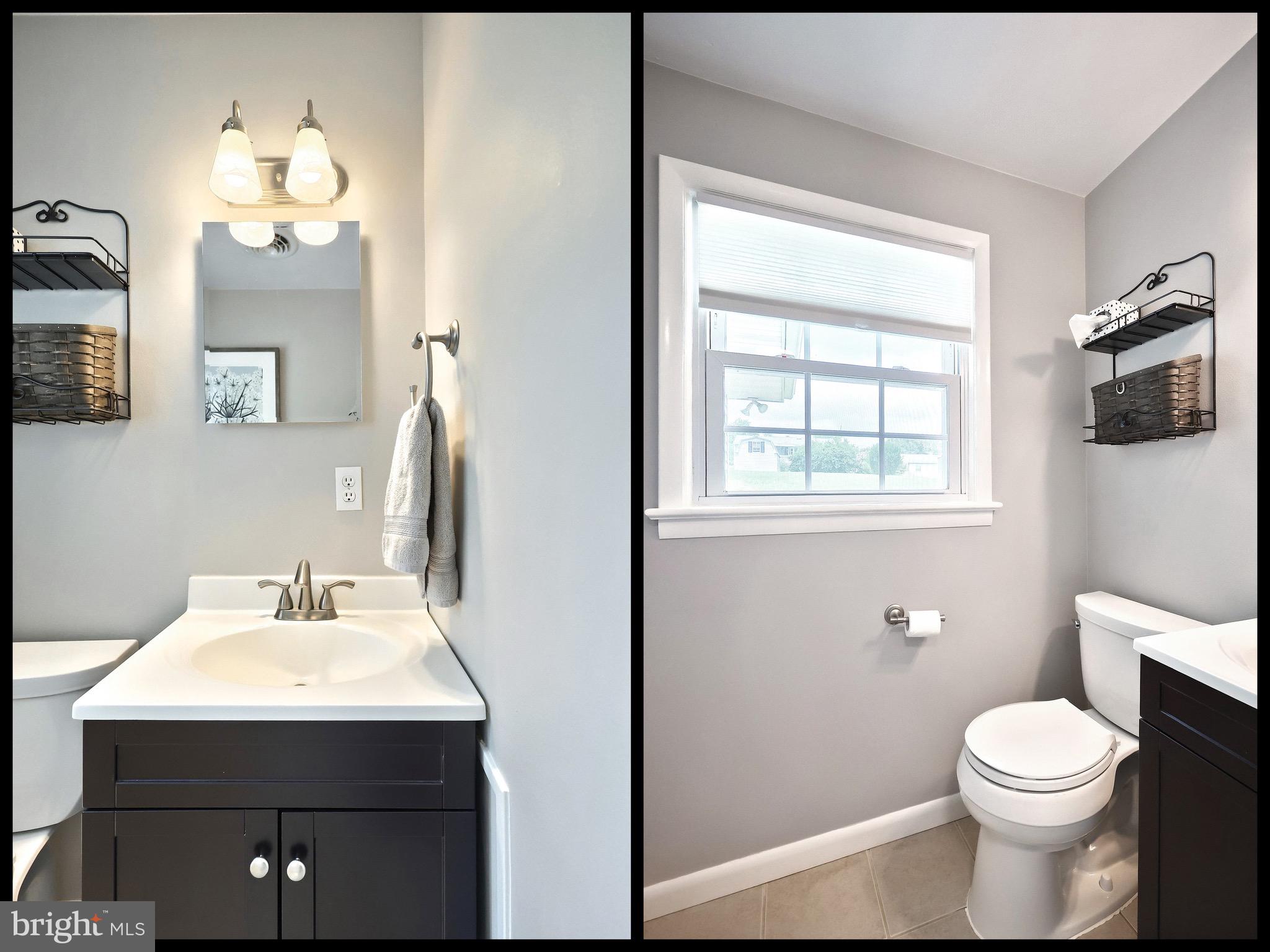 2569 Emig Mill Road Dover, PA 17315 - Photo 21 of 32 a bathroom with a sink mirror and toilet