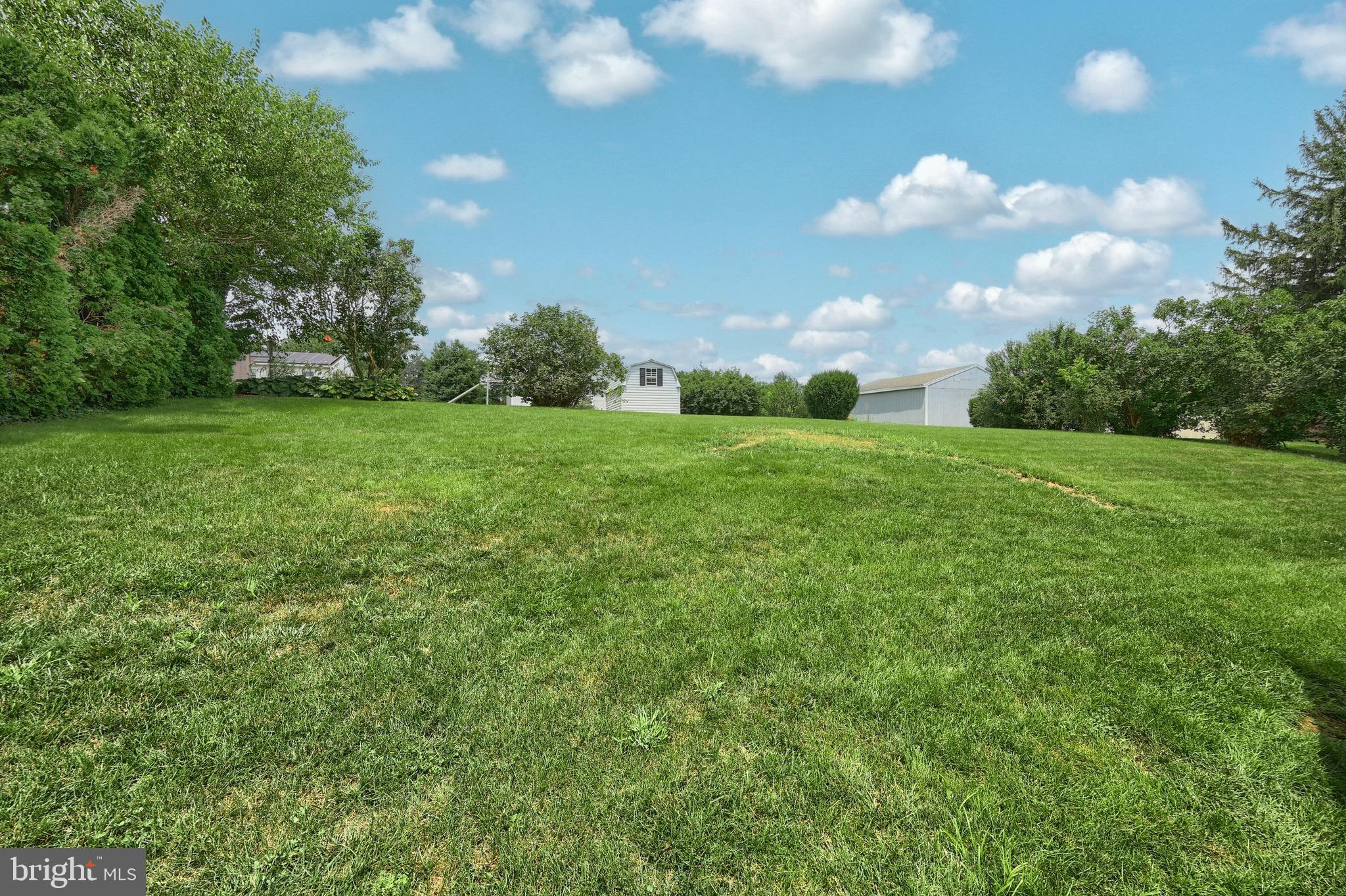 2569 Emig Mill Road Dover, PA 17315 - Photo 10 of 32 a view of a big yard with a house in the background